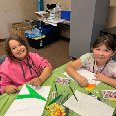 Two children painting.